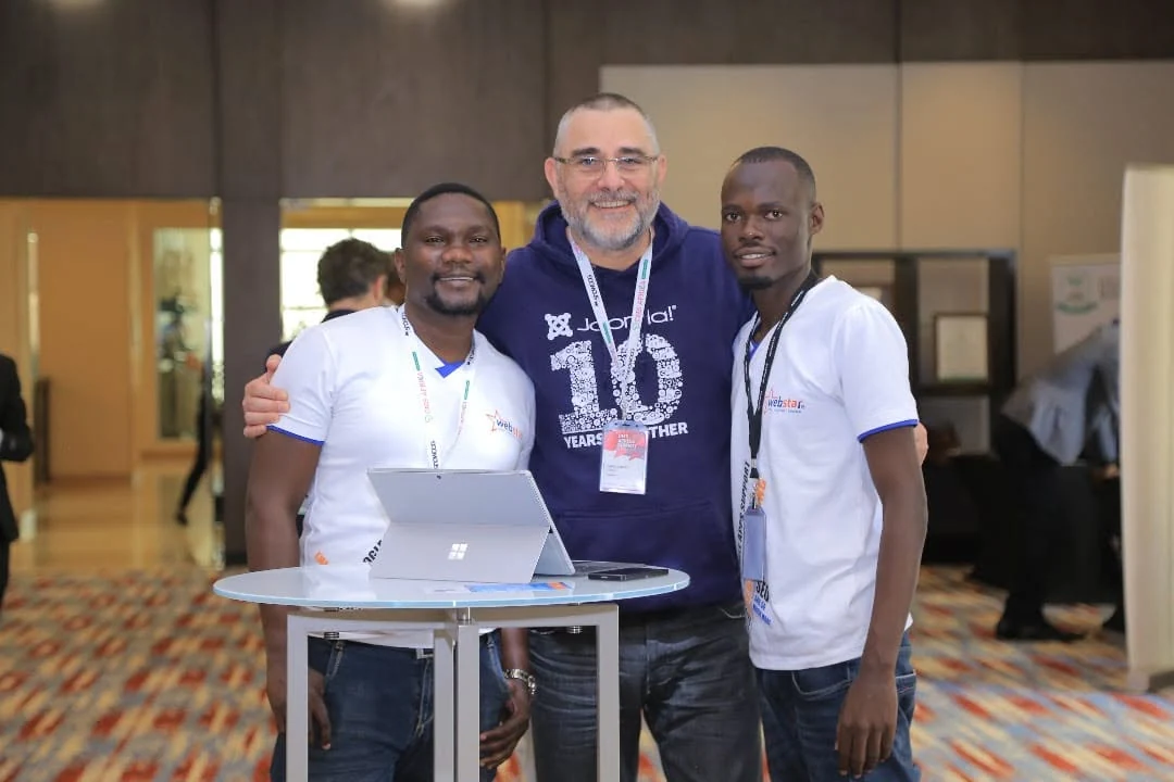 Fred Abunyanga, Martin and Ronald with a fellow conference participant in Kigali.